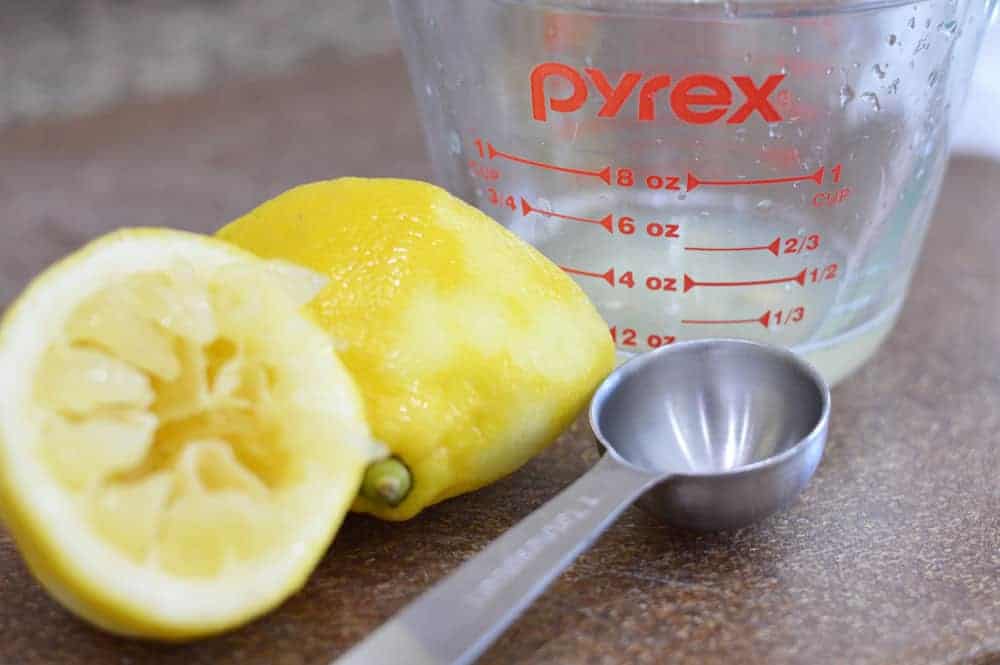 Juiced lemons with measuring spoon