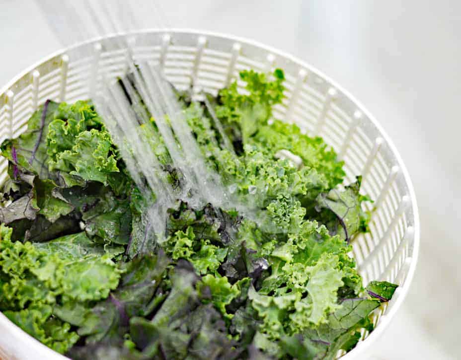 Rinsing the kale in a salad spinner