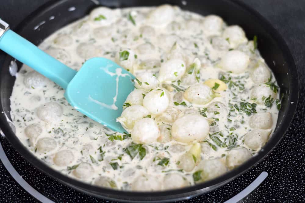 Pan full of pearl onions and cream