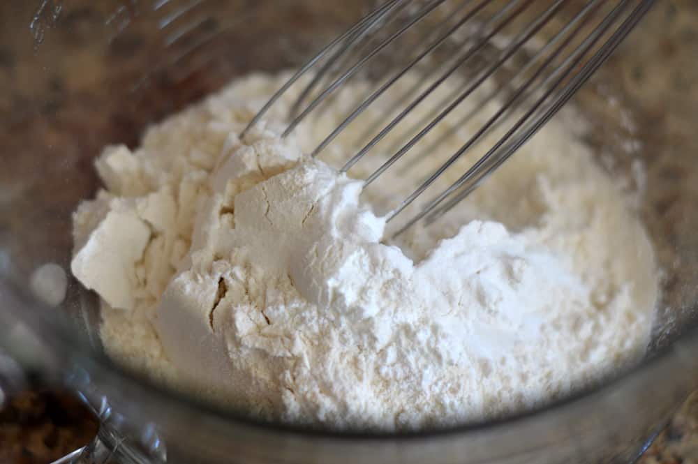 Whisking together the dry ingredients in a glass bowl