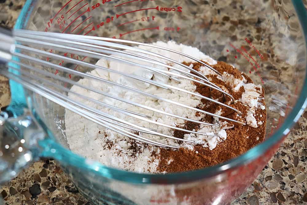 Bowl of spices with a whisk