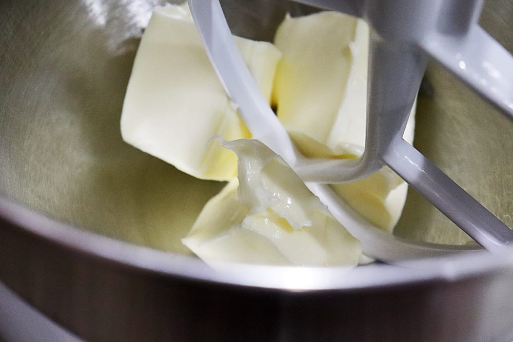 Vegan margarine in the bowl of an electric mixer