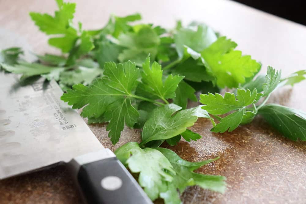 Chopped parsley with a chefs knife