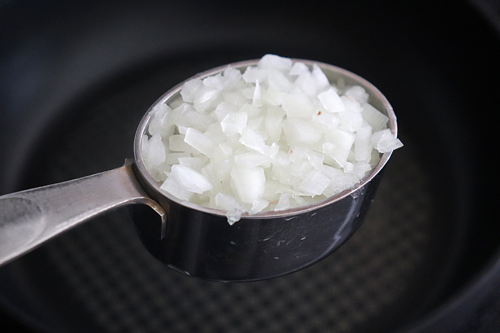 Adding onions to the saute pan