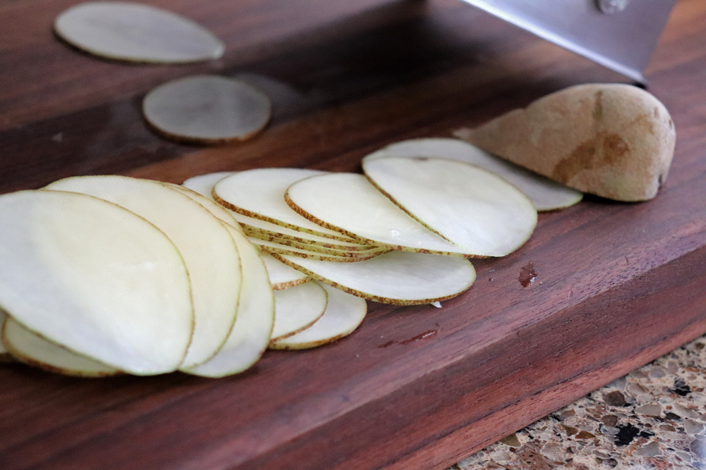 Thinly sliced potatoes using a mandolin
