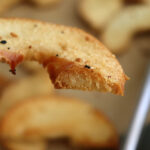 Bite shot of Homemade Oven Baked Bagel Chips Recipe