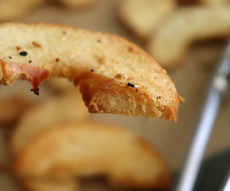 Bite shot of Homemade Oven Baked Bagel Chips Recipe