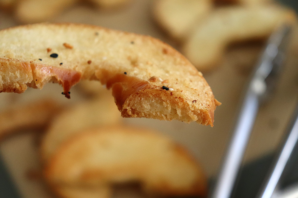 Bite shot of Homemade Oven Baked Bagel Chips Recipe
